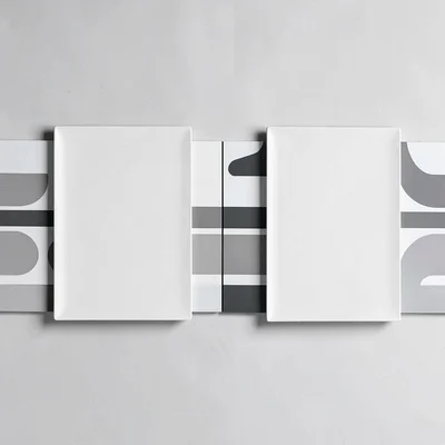 Side-by-side pair of two agenda plates separated by a hairline seam, abstract ro