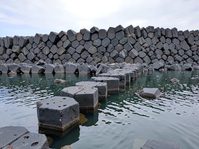 Column ends as stepping stones across water