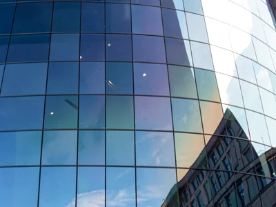 Curved glass showing distorted sky gradient