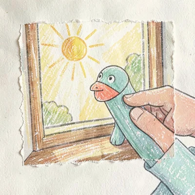 Small hand operating a finger puppet on a sunlit windowsill