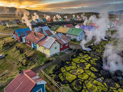 Volcanic otherworldly light in Iceland, a row of Reykjavik houses with colorful 