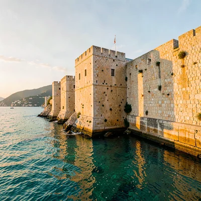 Adriatic limestone warmth, Dubrovnik honey stone, Stone fortress wall meeting ca