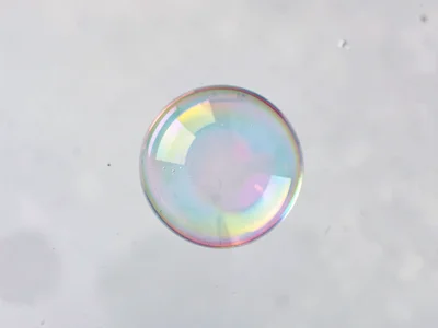 Single perfect sphere on film surface