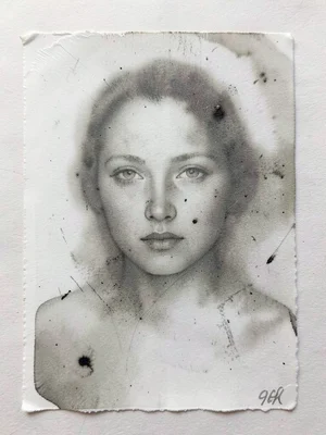 Ghost pull of a portrait monoprint, ethereal face emerging from the residual ink