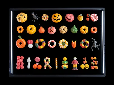 Scanner capture of halloween candy collection sorted by type, overhead detail