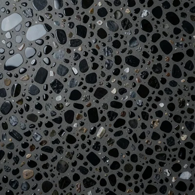 Volcanic terrazzo: basalt, obsidian, and pumice chips in dark grey cement, drama