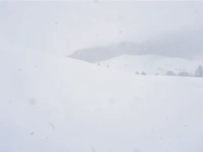 Whiteout with subtle horizon suggestion