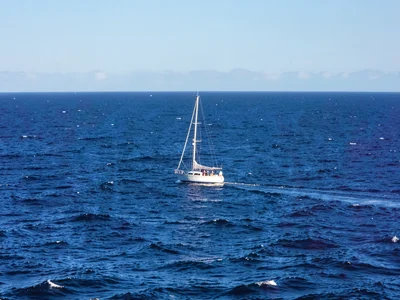 Single boat on vast sea