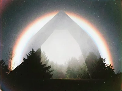 Fogbow in morning mist, white rainbow with faint color fringe