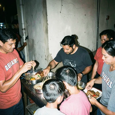 Street food vendor serving customers at night