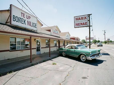 Roadside motel with vintage car parked
