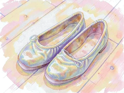 Worn ballet slippers on wooden floor