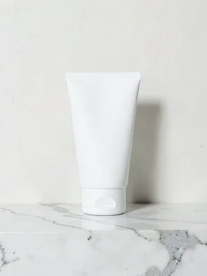 White matte tube hero shot on linen