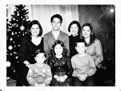 Multiple-generation copy of Christmas family photo, faces softened by time