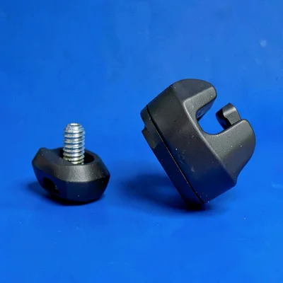 Flat-color composition of a bike pedal and shoe cleat in chunky shapes on a coba