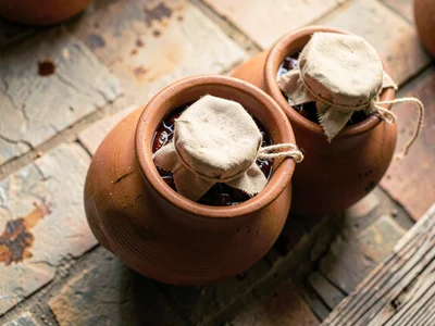 Gochujang Aging in Cloth-Covered Onggi Pots