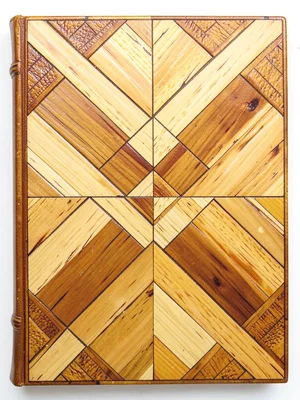 A straw marquetry book cover with a geometric lattice pattern, corner details vi
