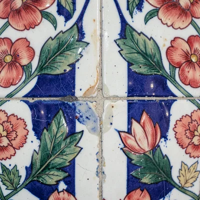 Close-up of tile edge joining — where two panels meet, showing glaze pooling