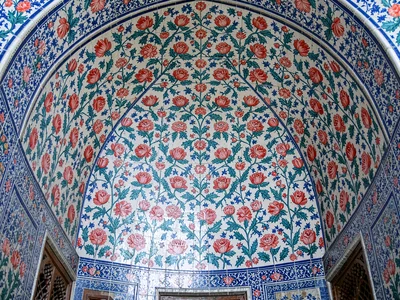 Grand mosque tile wall — wide view of the full repeating field covering a curved