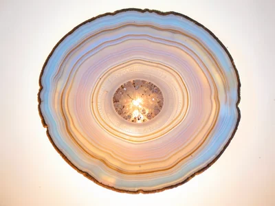 Agate slice with banding resembling spring aurora, soft pastel layers