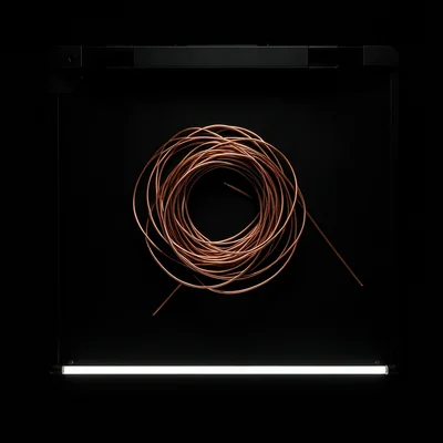 Tangled ball of copper wire on the scanner bed, complex shadow patterns from the