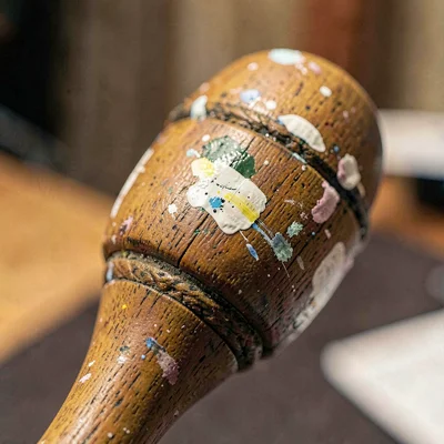 Worn texture of a stage wand with paint scuffed from years of grip