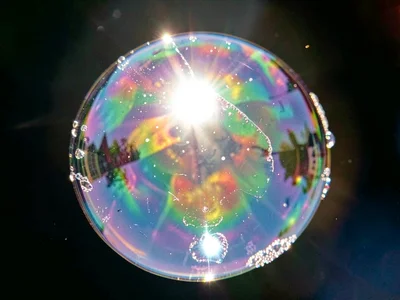 Bubble catching light creating bright highlight