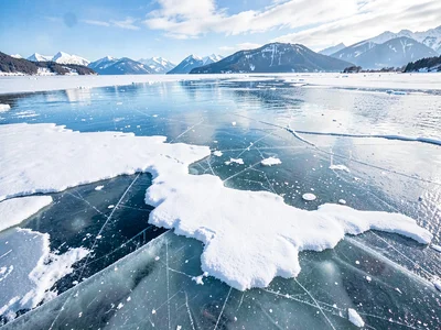 Surface texture where snow melted on clear ice