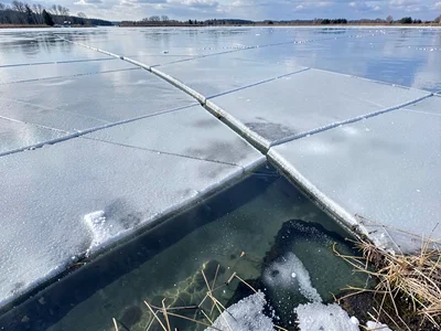 Thin ice with visible water beneath