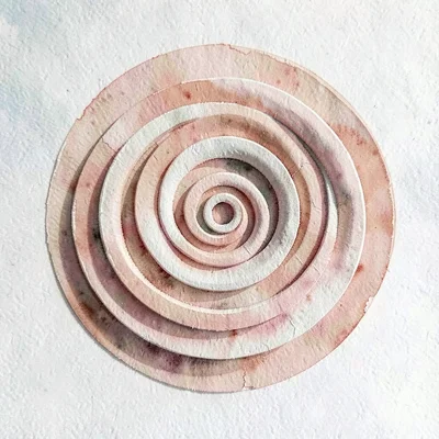 Stacked paper rings expanding outward like a heartbeat ripple, blush and clay pa