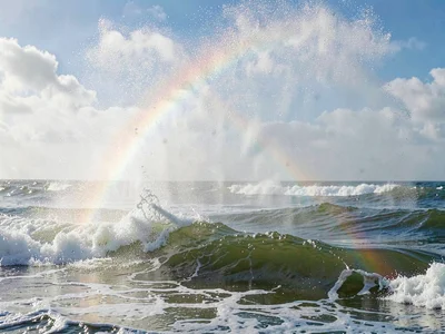 Spray catching light creating rainbow