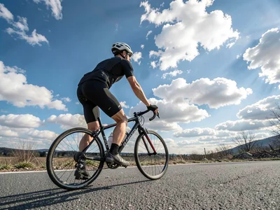 Cyclist against sky