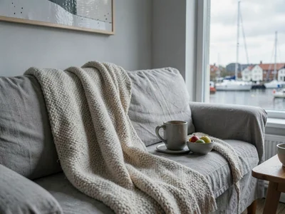 Comfortable grey harbor light in Gothenburg, Sweden, a wool blanket draped over 