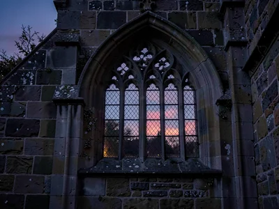 Church window from outside at dusk