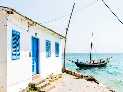 Brilliant Indian Ocean noon light in Dar es Salaam, White-washed building facade