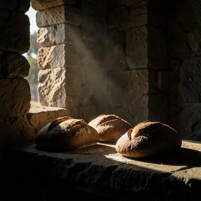 Dramatic natural light streaming through stone openings, deep chiaroscuro shadow