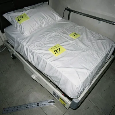A made bed with hospital corners documented in clinical evidence style