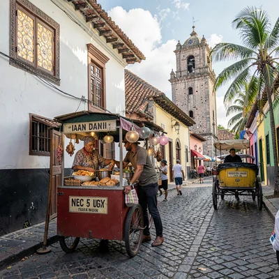 Vigan colonial heritage, Spanish-Filipino fusion, empanada vendor on cobblestone