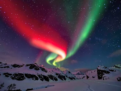Rare red aurora at high altitude against stars