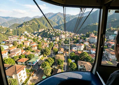 Eternal spring light over transforming Medellín, cable car interior view looking