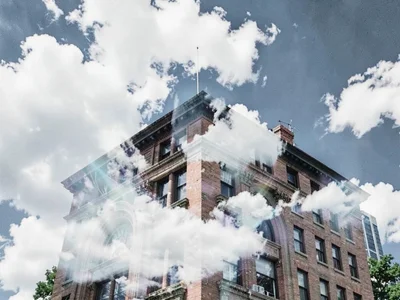 Building with sky clouds merging