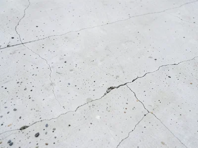 White architectural concrete, smooth cast surface in pale cement with minimal ag