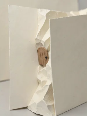 The tiny papercraft door installs flush in the side of a much larger flat cardst