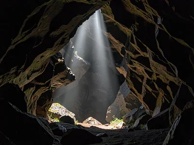 Shaft of light in cave entrance