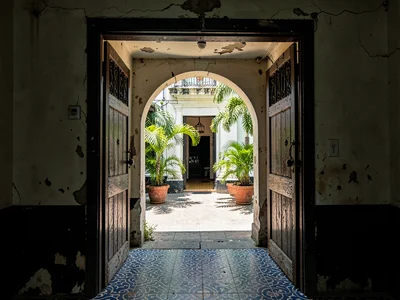 Courtyard Through Dark Arch