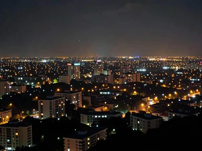 City lights coming on