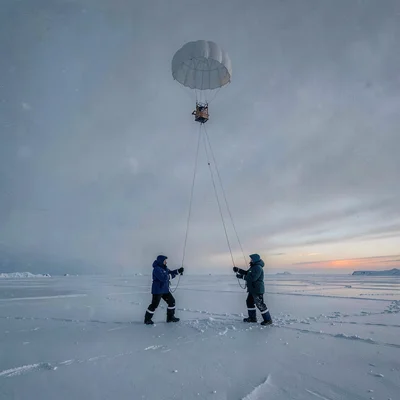Arctic conditions photograph, extreme cold environment, A weather balloon being 