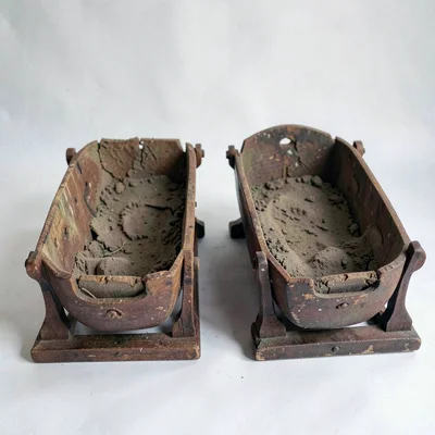 Open grave and open cradle positioned side by side, the bookends we don't choose