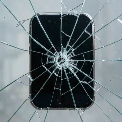 Broken smartphone screen, cracked glass pattern study, shattered technology