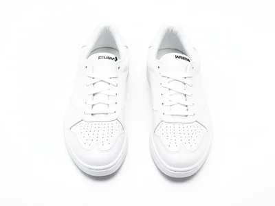 White sneaker pair arranged